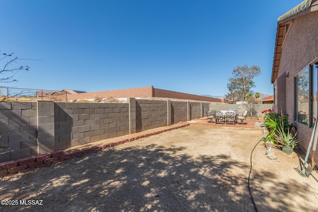 5608 Shady Grove, Tucson, AZ 85742 - fenced backyard with a patio area and outdoor dining space