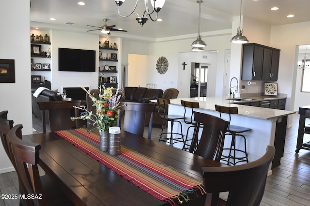 8867 S Welsh Pl, Hereford, AZ 85615 - dining area featuring a ceiling fan, wood finished floors, recessed lighting, and a chandelier