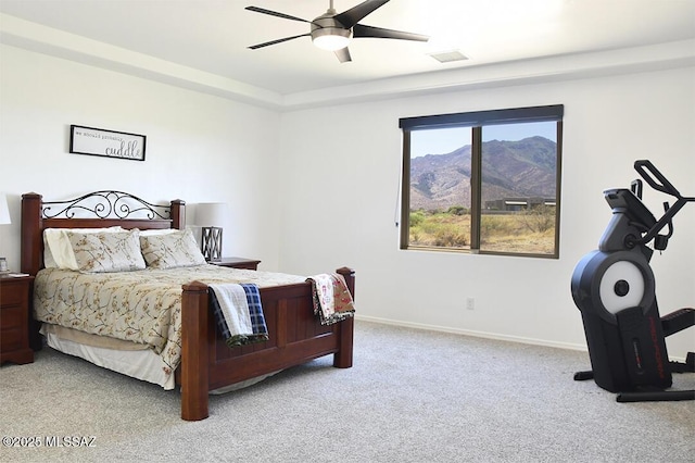 8867 S Welsh Pl, Hereford, AZ 85615 - bedroom featuring light colored carpet, a mountain view, baseboards, and a ceiling fan