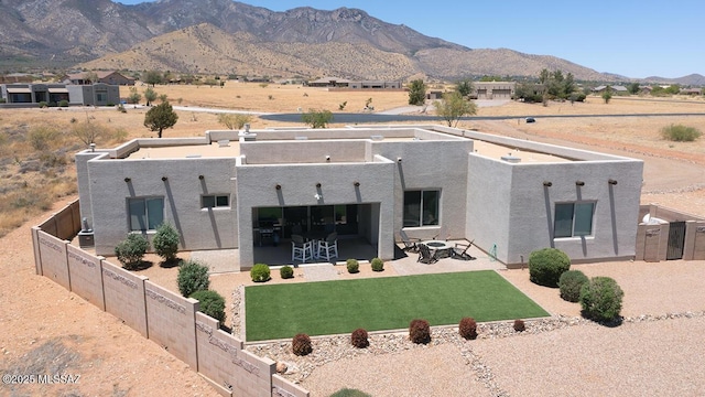 8867 S Welsh Pl, Hereford, AZ 85615 - back of property with a patio area, a mountain view, and stucco siding