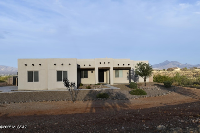 8867 S Welsh Pl, Hereford, AZ 85615 - pueblo revival-style home with a mountain view and stucco siding