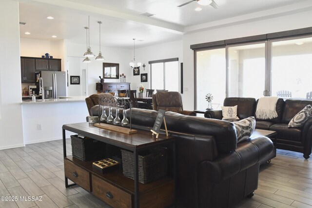 8867 S Welsh Pl, Hereford, AZ 85615 - living area featuring ceiling fan, wood finished floors, recessed lighting, and baseboards