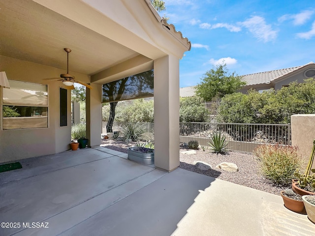 13401 N Rancho Vistoso Blvd Unit 190, Oro Valley, AZ 85755 - fenced backyard featuring a ceiling fan and a patio area