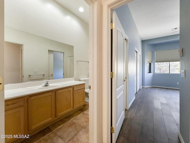 13401 N Rancho Vistoso Blvd Unit 190, Oro Valley, AZ 85755 - bathroom with toilet, vanity, and baseboards
