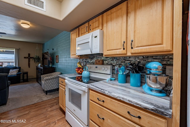 413 N Calle Del Diablo, Green Valley, AZ 85614 - kitchen with white appliances, light wood-style floors, tasteful backsplash, and open floor plan
