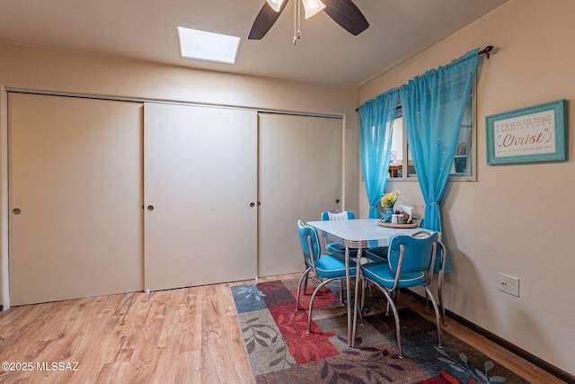 413 N Calle Del Diablo, Green Valley, AZ 85614 - dining space featuring wood finished floors, a skylight, and a ceiling fan