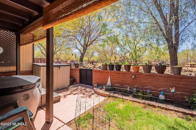 413 N Calle Del Diablo, Green Valley, AZ 85614 - view of patio featuring a fenced backyard and a hot tub