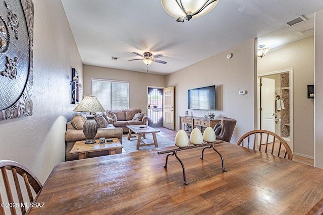 1012 W Via Del Placio, Green Valley, AZ 85614 - dining space with a textured wall, ceiling fan, and baseboards
