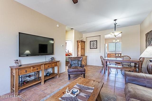 1012 W Via Del Placio, Green Valley, AZ 85614 - living area featuring a chandelier