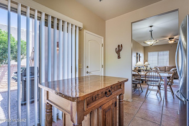 1012 W Via Del Placio, Green Valley, AZ 85614 - kitchen featuring freestanding refrigerator, open floor plan, a ceiling fan, and decorative light fixtures