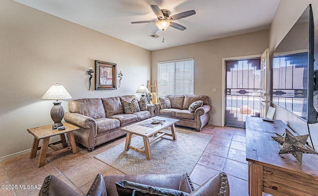 1012 W Via Del Placio, Green Valley, AZ 85614 - living room with healthy amount of natural light, ceiling fan, and baseboards