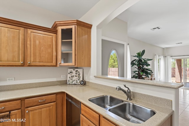 45 N Lookout Knob Dr, Sahuarita, AZ 85629 - kitchen featuring a sink, stainless steel dishwasher, light countertops, glass insert cabinets, and light tile patterned floors