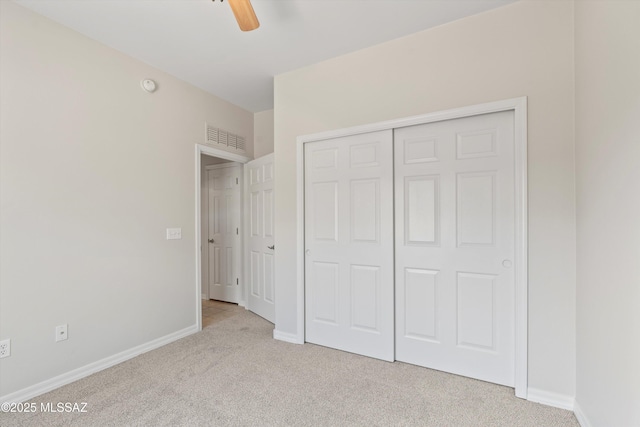 45 N Lookout Knob Dr, Sahuarita, AZ 85629 - unfurnished bedroom with carpet flooring, a closet, baseboards, and ceiling fan
