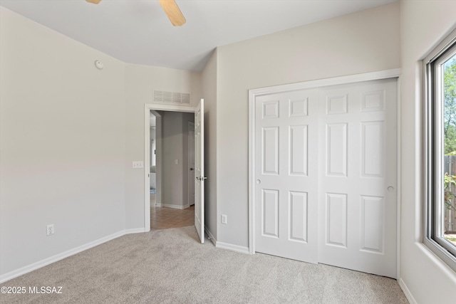 45 N Lookout Knob Dr, Sahuarita, AZ 85629 - unfurnished bedroom featuring carpet floors, a closet, baseboards, and a ceiling fan