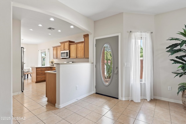 45 N Lookout Knob Dr, Sahuarita, AZ 85629 - foyer entrance with light tile patterned flooring, recessed lighting, baseboards, and arched walkways