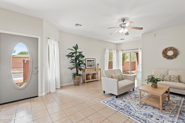 45 N Lookout Knob Dr, Sahuarita, AZ 85629 - living room with a ceiling fan, light tile patterned floors, and baseboards