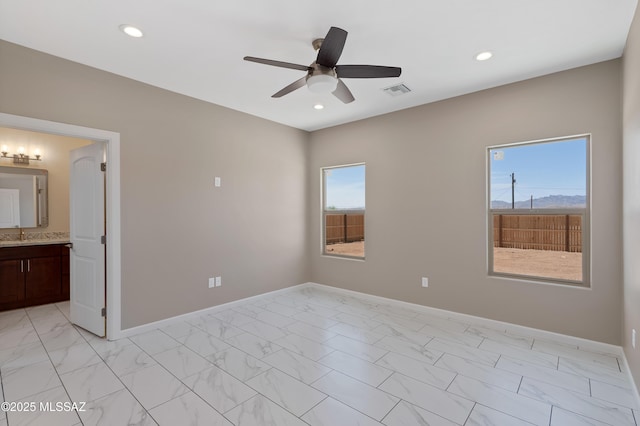 1814 Cajeme Ct, Rio Rico, AZ 85648 - spare room featuring light marble finish flooring, a ceiling fan, baseboards, and recessed lighting