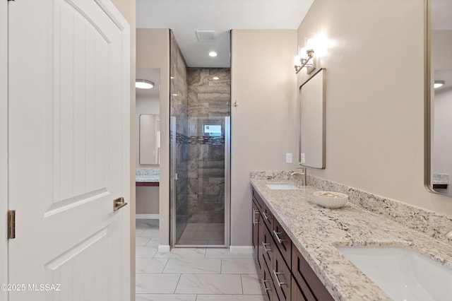 1814 Cajeme Ct, Rio Rico, AZ 85648 - full bathroom featuring marble look tile flooring, a shower stall, double vanity, and baseboards