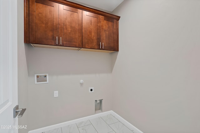 1814 Cajeme Ct, Rio Rico, AZ 85648 - laundry area with hookup for a washing machine, cabinet space, electric dryer hookup, marble finish flooring, and baseboards