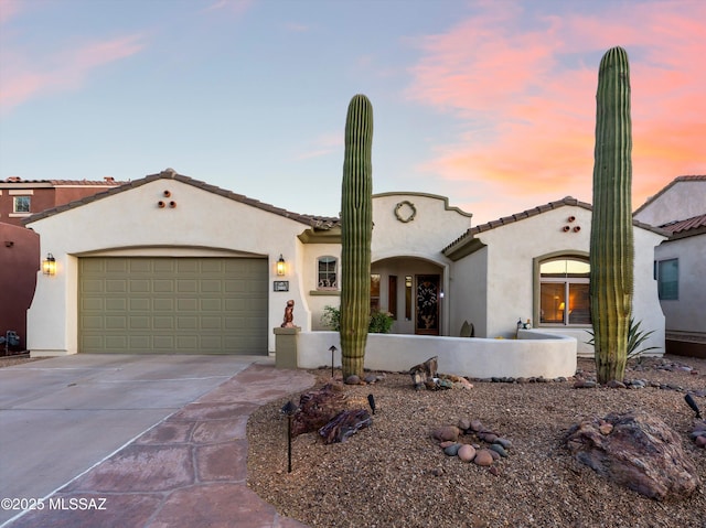 380 E Via Puente De La Lluvia, Sahuarita, AZ 85629 - mediterranean / spanish home featuring driveway, stucco siding, an attached garage, and a tile roof
