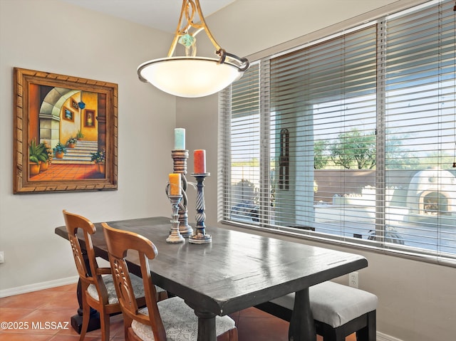 380 E Via Puente De La Lluvia, Sahuarita, AZ 85629 - tiled dining space with baseboards