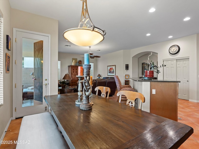 380 E Via Puente De La Lluvia, Sahuarita, AZ 85629 - dining area featuring light tile patterned flooring, recessed lighting, arched walkways, and baseboards