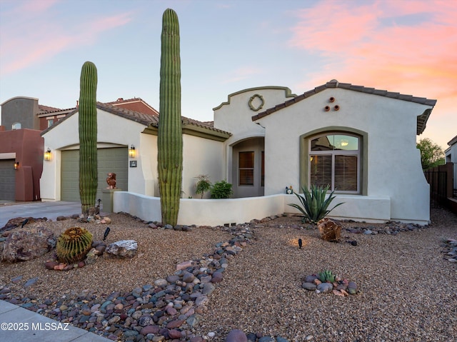380 E Via Puente De La Lluvia, Sahuarita, AZ 85629 - mediterranean / spanish house with concrete driveway, a garage, stucco siding, and a tile roof