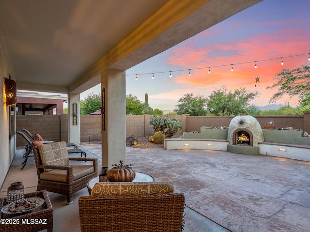 380 E Via Puente De La Lluvia, Sahuarita, AZ 85629 - fenced backyard with a patio area and an outdoor hangout area