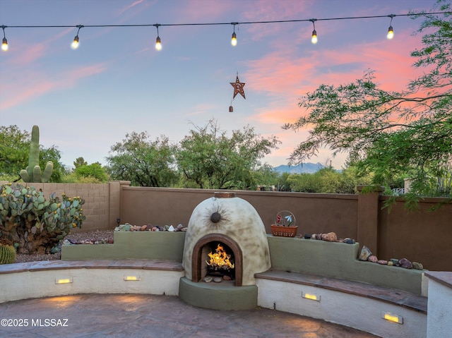 380 E Via Puente De La Lluvia, Sahuarita, AZ 85629 - view of patio terrace at dusk