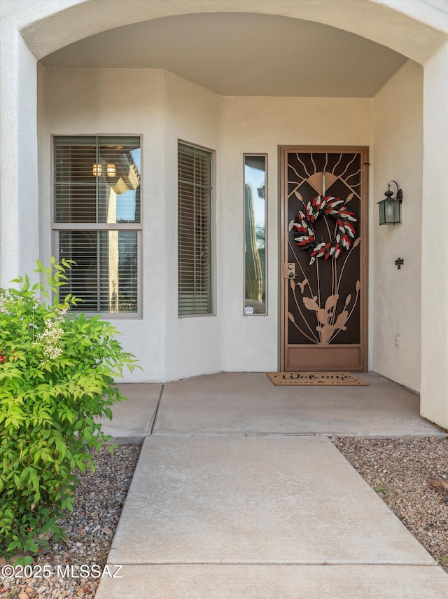 380 E Via Puente De La Lluvia, Sahuarita, AZ 85629 - doorway to property with stucco siding