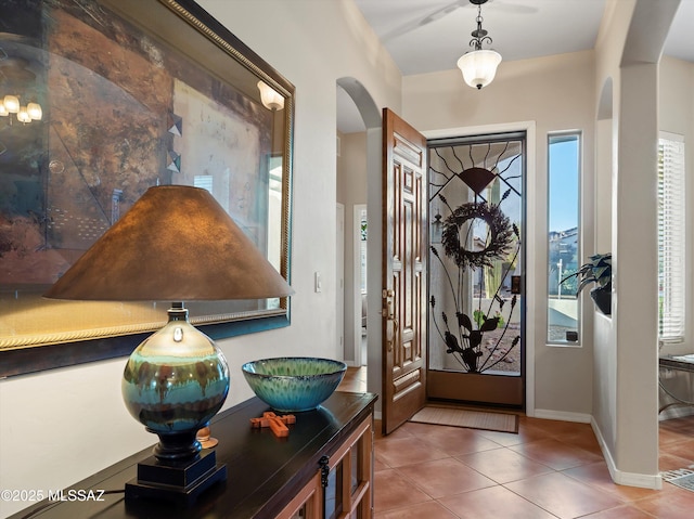 380 E Via Puente De La Lluvia, Sahuarita, AZ 85629 - entrance foyer with arched walkways, tile patterned floors, and baseboards