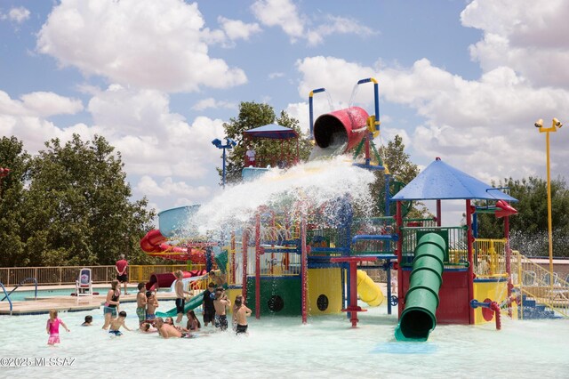 380 E Via Puente De La Lluvia, Sahuarita, AZ 85629 - community jungle gym featuring a water play area and a community pool