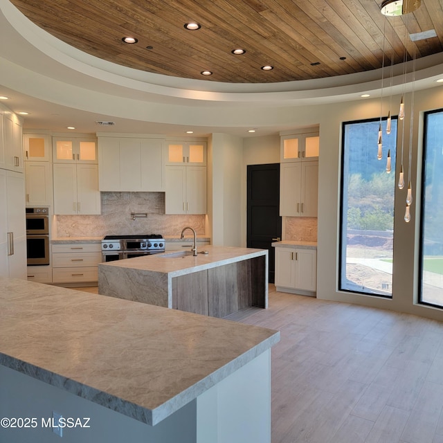 14295 N Silent Sky Pl, Marana, AZ 85658 - kitchen featuring stainless steel appliances, wood ceiling, recessed lighting, backsplash, and light wood-type flooring