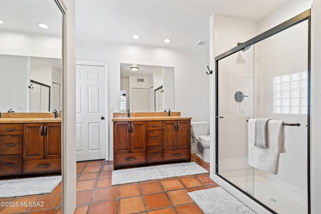 2302 N Norton Ave, Tucson, AZ 85719 - full bath with vanity, toilet, a shower stall, tile patterned flooring, and recessed lighting