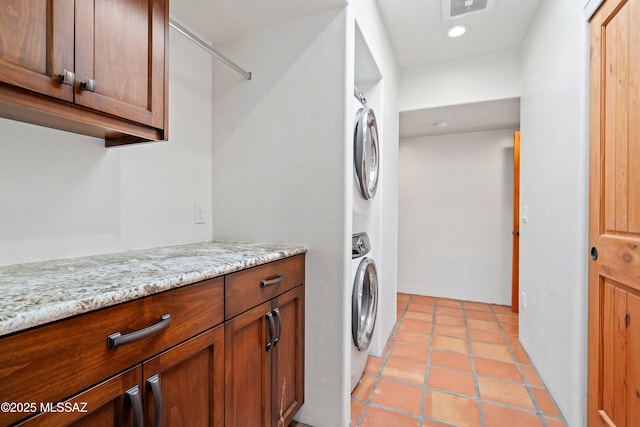 2302 N Norton Ave, Tucson, AZ 85719 - laundry room featuring stacked washer and clothes dryer, recessed lighting, and light tile patterned floors