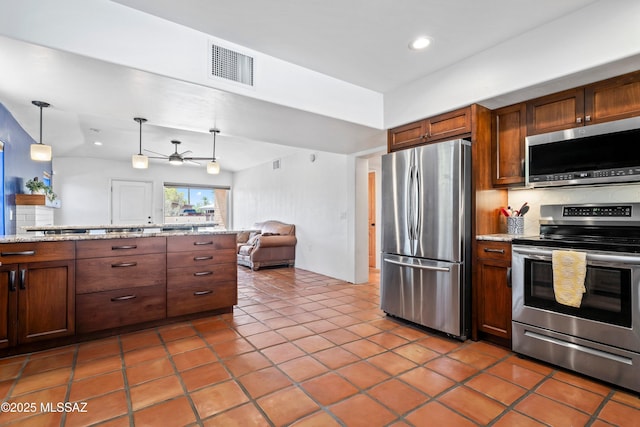 2302 N Norton Ave, Tucson, AZ 85719 - kitchen featuring stainless steel appliances, open floor plan, a ceiling fan, recessed lighting, and hanging light fixtures
