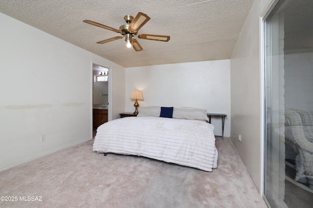 201 N Cloverland Ave, Tucson, AZ 85711 - carpeted bedroom featuring a textured ceiling and ensuite bath