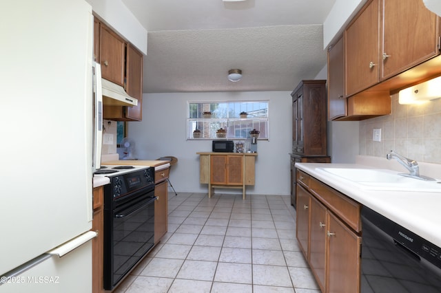 201 N Cloverland Ave, Tucson, AZ 85711 - kitchen featuring black appliances, under cabinet range hood, a sink, light countertops, and light tile patterned flooring