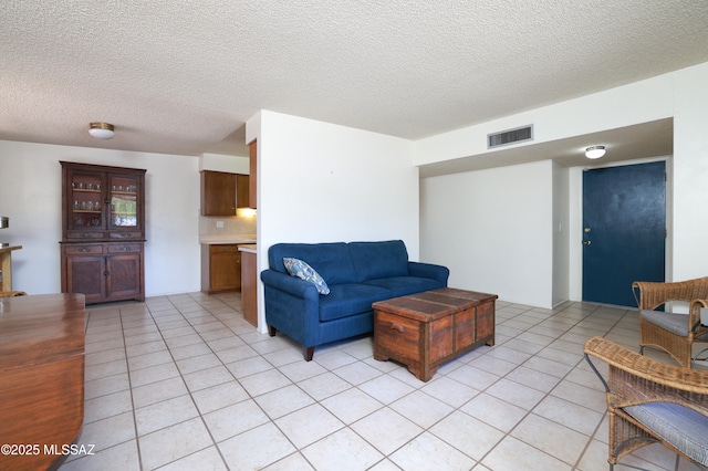201 N Cloverland Ave, Tucson, AZ 85711 - living area featuring light tile patterned floors and a textured ceiling