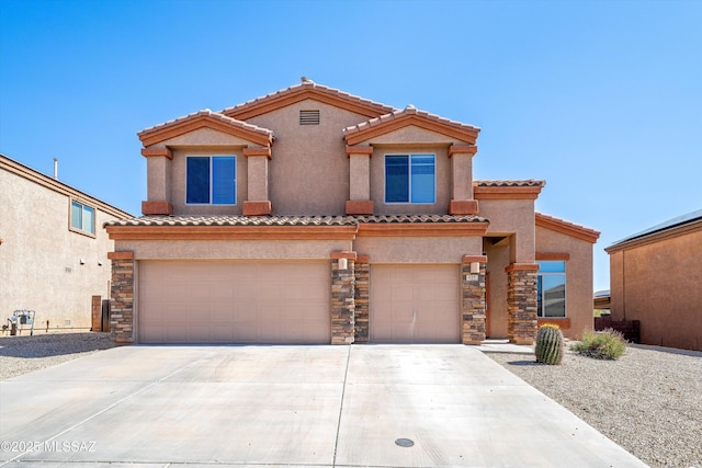 139 W Cheevers St, Vail, AZ 85641 - mediterranean / spanish-style home featuring driveway, a tile roof, and stone siding