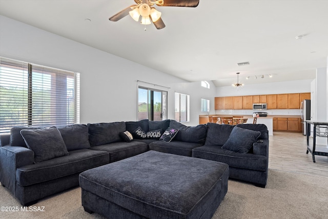 139 W Cheevers St, Vail, AZ 85641 - living area featuring vaulted ceiling, a ceiling fan, and light colored carpet