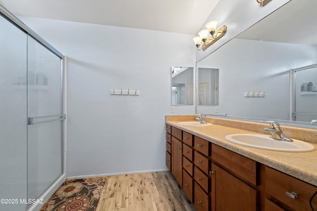 139 W Cheevers St, Vail, AZ 85641 - bathroom with wood finished floors, a shower with door, double vanity, and baseboards