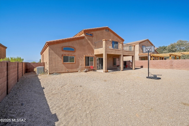 139 W Cheevers St, Vail, AZ 85641 - rear view of property featuring a balcony, a fenced backyard, a patio, stucco siding, and central AC