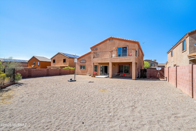 139 W Cheevers St, Vail, AZ 85641 - back of house featuring a balcony, a fenced backyard, a gate, stucco siding, and a patio area