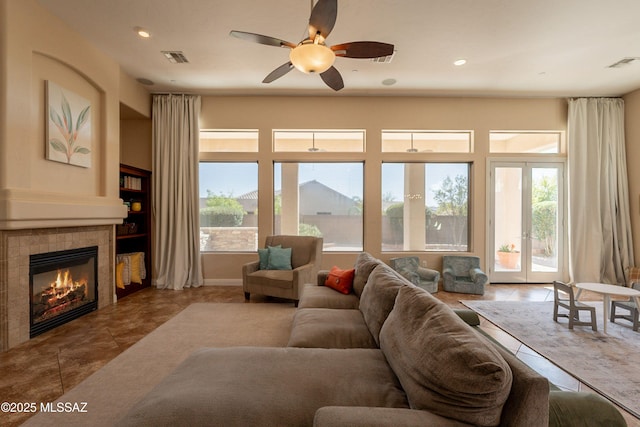 13715 N Tessali Way, Tucson, AZ 85755 - living room with plenty of natural light, a tile fireplace, ceiling fan, recessed lighting, and tile patterned floors