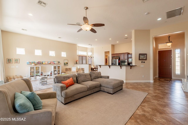 13715 N Tessali Way, Tucson, AZ 85755 - living area with plenty of natural light, a ceiling fan, recessed lighting, and baseboards