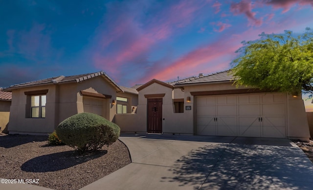 13715 N Tessali Way, Tucson, AZ 85755 - ranch-style house featuring driveway, a tile roof, a garage, and stucco siding