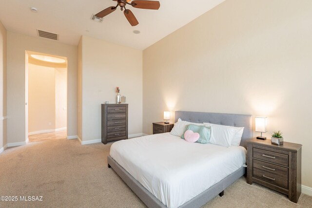 13715 N Tessali Way, Tucson, AZ 85755 - bedroom featuring light carpet, baseboards, and ceiling fan