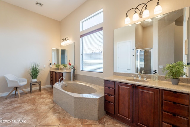13715 N Tessali Way, Tucson, AZ 85755 - bathroom featuring a shower stall, a bath, two vanities, a towering ceiling, and tile patterned flooring
