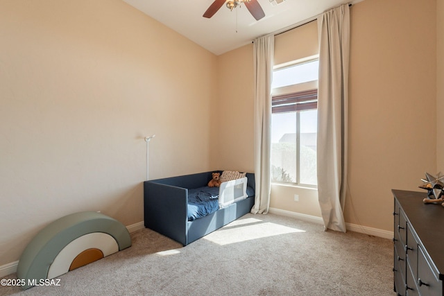13715 N Tessali Way, Tucson, AZ 85755 - bedroom with light colored carpet, baseboards, and ceiling fan